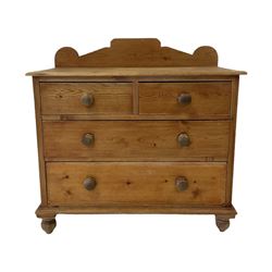 Pine chest of drawers, the raised back over two short and two long drawers, raised on turned supports 