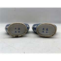 Pair of late 19th/ early 20th century Chinese Famille Verte pilgrim flasks/ vases, both having two panels depicting scenes of figures within landscape settings on blue ground decorated with scrolling foliage and Ruyi shaped handles, four character Kangxi mark beneath H24.5cm 