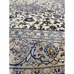 Persian fine Kashan ivory ground carpet, centred by floral medallion, triple guarded border 