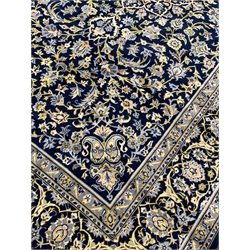 Persian Keshan blue ground rug carpet, central medallion, field decorated with interlacing floral and foliage design, repeating border, 345cm x 230cm