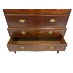 George III mahogany chest on chest, the dental cornice over seven drawers, raised on splayed supports 