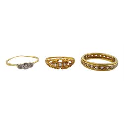 Gold white stone set full eternity ring and two gold diamond set rings, all 18ct
