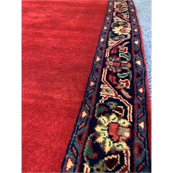 Persian red ground runner, guarded border decorated with floral design 