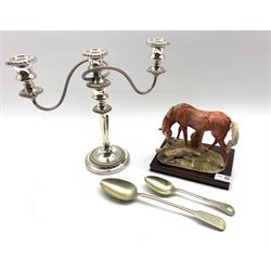 Resin horse group, silver-plated candelabra and two silver-plated serving spoons