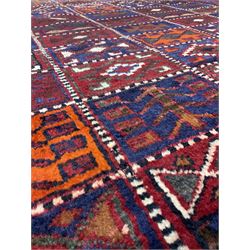 Persian garden rug, with multicoloured tiles and navy blue border 250cm x 180cm