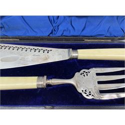 Pair of Victorian silver bladed fish servers with engraved and pierced decoration and bone handles, cased,  Sheffield 1889, Makers Harrison Bros. and Howson