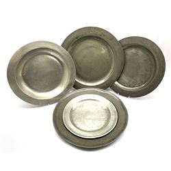Five 18th/ 19th century pewter chargers and plates, some with touch marks, D42cm max (5)