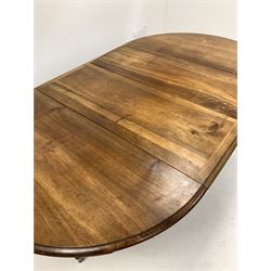 Victorian walnut oval extending dining table, the top raised on an octagonal column and four scrolled splayed supports with brass castors, decorated with incised ebonised detail, with two additional leaves,
