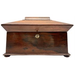 Victorian rosewood sarcophagus form tea caddy, top opening to reveal a fitted interior having central mixing bowl flanked by two rosewood cannisters, L34cm x H23cm