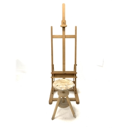 Pine artists adjustable easel, (H172cm, W56cm) together with a pine circular rise and fall stool, (D30cm)
