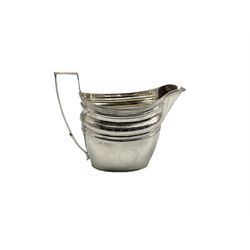 George III silver cream jug decorated with an engraved hatched band and with vacant cartouche and reeded handle H10cm London 1800 4.5oz