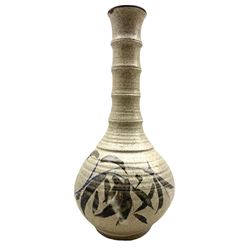 Robert Tinnyunt (Burmese 1940-): Stoneware bottle-shaped vase with bamboo effect neck, brush decoration on speckled oatmeal ground, H39cm 