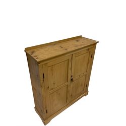 19th century pine cupboard, the raised back over two cupboard doors, opening to reveal three fixed shelves, raised on bracket supports 