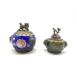 Early 20th century Chinese hardstone lidded jar with brass mounts, pierced cover and mask handles, together with a similar porcelain lidded jar, tallest H8cm (2)