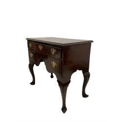 George III mahogany and pine-lined low-boy side table, the moulded top above one long frieze drawer and two short drawers around an arched apron, on cabriole legs with pointed pad feet