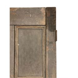 Large 19th century pine door, panelled with applied mouldings, fitted with two metal hinges
