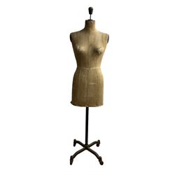 Early 20th century female torso dressmakers dummy or mannequin by Stockman, stamped 'Stockman, Paris-London, Brevete S.G.D.G./5169' of cloth construction on telescopic cast iron base with four legs and castors, H158cm x W40cm 