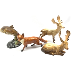 Beswick model of a Standing Stag No. 981, another of a Lying Stag No. 954, another of a Fox No. 1016A and another of a Trout No. 1032 (4) 