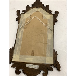 20th century Georgian style mahogany mirror, shaped fret work frame, stepped arched aperture with moulded gilt slip and cross grain banding, 71cm x 40cm