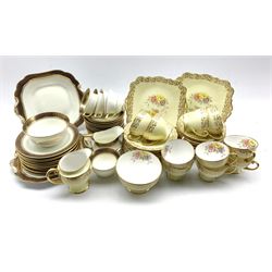 Early 20th century Aynsley tea set, decorated with cobalt blue and gilt borders comprising five cups, eleven saucers, milk jug, sugar bowl, eleven plates and two serving plates, together with a Royal Standard tea set 