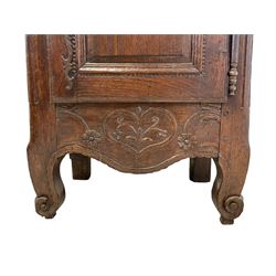 18th century French oak cupboard, the projecting cornice over floral carved frieze, enclosed by two shaped panelled doors and fitted with drawer, on scroll carved cabriole supports, W72cm, H174cm, D49cm