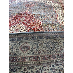 Kashmir full pile rug, with traditional floral medallion on duck egg blue field with ivory spandrels enclosed by guarded border 