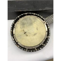 Early 20th century five-string banjo, mother of pearl inlaid ebonised frame and segmented walnut back and sides, L85cm with case 