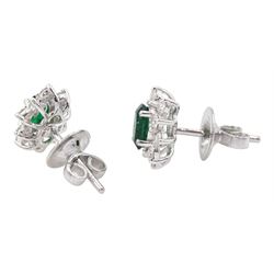Pair of 18ct white gold oval cut emerald and round brilliant cut diamond cluster stud earrings, total emerald weight approx 0.75 carat, total diamond weight approx 0.60 carat