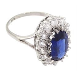 Early - mid 20th century platinum oval cut sapphire and old cut diamond cluster ring, stamped Plat, sapphire approx 1.80 carat, total diamond weight approx 0.70 carat