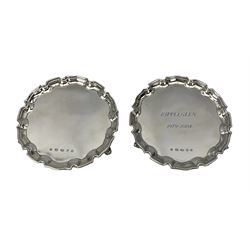 Pair of modern silver circular card trays with pie crust borders and scroll feet, one with inscription D15cm London 2005, Rippleglen sponsors mark