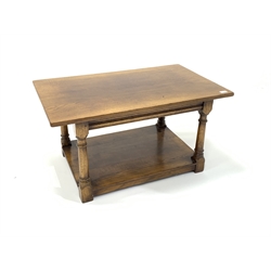 Titchmarsh and Goodwin style honey oak coffee table, raised on turned and block supports united by under tier. 