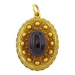 Victorian Etruscan revival gold cabochon garnet pendant, with applied granulation and wirework decoration and glazed back