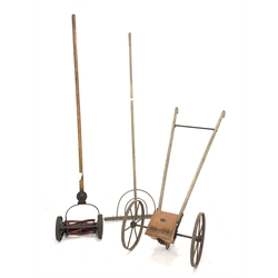 Vintage garden tools - wooden rake, 'Ransomes Cub' lawn mower and 'Horace Fuller' seed drill