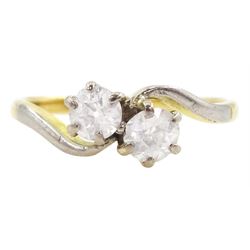 Early 20th century gold two stone old cut diamond crossover ring, stamped 18ct Plat, total diamond weight approx 0.55 carat