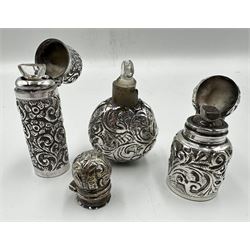 Late Victorian silver scent flask chased with scrolls, hinged cover and interior glass stopper H4cm Birmingham 1898 Maker C.C.May & Sons, another of cylindrical design with flower heads and scrolls London 1901 and another scent flask, damaged (3)