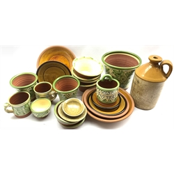 Peter Dick (1936-2012) Coxwold studio pottery to include a floral decorated planter, graduated plates, mug, bowls, together with other studio pottery items and a J.W. Sinkinson, York Botanical Brewers flagon