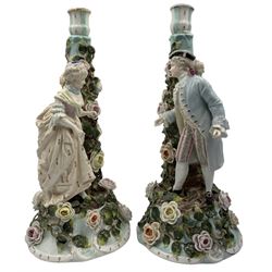 Pair of late 19th/ early 20th century Sitzendorf candlesticks modelled as a galllant and his lady and decorated with applied flowers H37cm