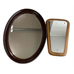 Early 20th century bevel edge oval wall mirror in moulded frame 63cm x 87cm and a G Plan style mirror