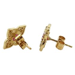 Pair of 9ct gold oval ruby and round brilliant cut diamond flower design stud earrings