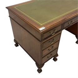 Early 20th century Georgian design stained beech twin pedestal desk, rectangular top with inset green leather writing surface, fitted with nine drawers, on ball and claw feet