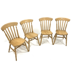 Set four beech wood Windsor style comb back dining chairs, with shaped seats raised on ring turned supports united by stretchers, W40cm