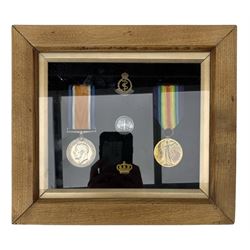 Pair of World War I medals to 122029 A/Cpl Alfred Stanley Maddison, framed with RAMC and other badges, inscribed on the reverse 'Born 1891, Enlisted 1916'