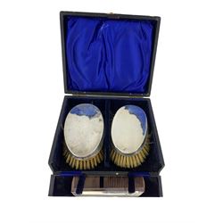 Pair of silver backed brushes and silver mounted comb, in fitted case 