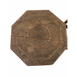 Indian hardwood octagonal occasional table, the top carved in relief with a concentric floral design, the folding base with pierced fretwork detail (W53cm) together with a large hardwood and brass banded bowl on a folding cruciform base (D79cm) 