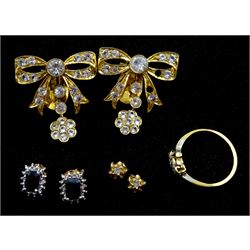 Pair of 14ct gold stone set bow clip on earrings, pair of 9ct gold sapphire and diamond cluster stud earrings, pair of 9ct diamond stud earrings and a 16ct gold three stone diamond ring