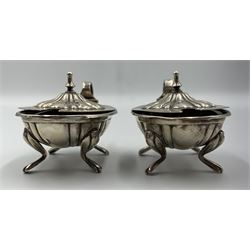 Pair Continental 800 standard silver salts of oval design with loop handles, clear glass liners and on four shaped supports