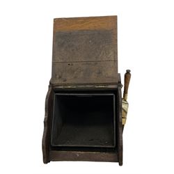 Edwardian oak and brass mounted coal scuttle, fall front with applied panel enclosing lead liner, on shaped end supports, with brass shovel