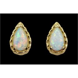 Pair of 9ct gold pear opal stud earrings, stamped