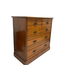 Edwardian walnut chest of drawers, the two short and three long drawers raised on a plinth base W107cm, 105cm D54cm

