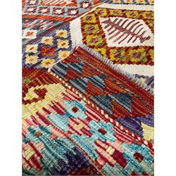 Chobi Kilim multi-colour rug, the field with all-over lozenges with contrasting central decoration and stylised flower heads, the two-band border with further geometric designs of alternating colours